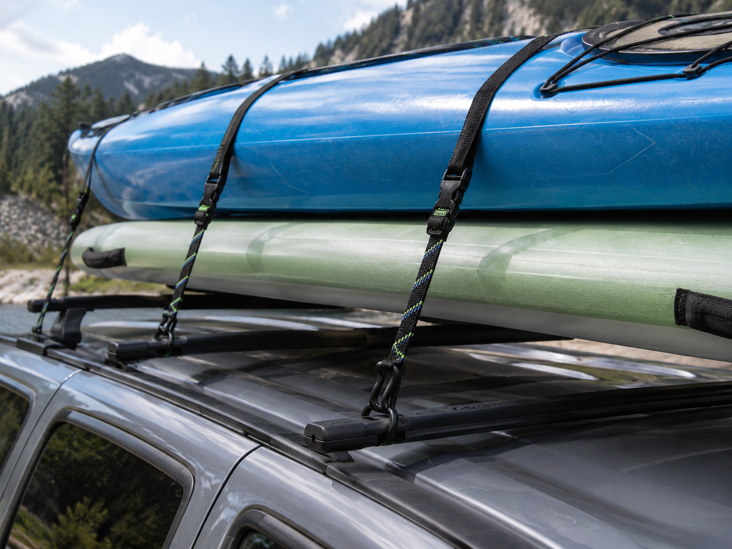Contractor Grade Adjustable Straps holding kayak and paddle board on a vehicle